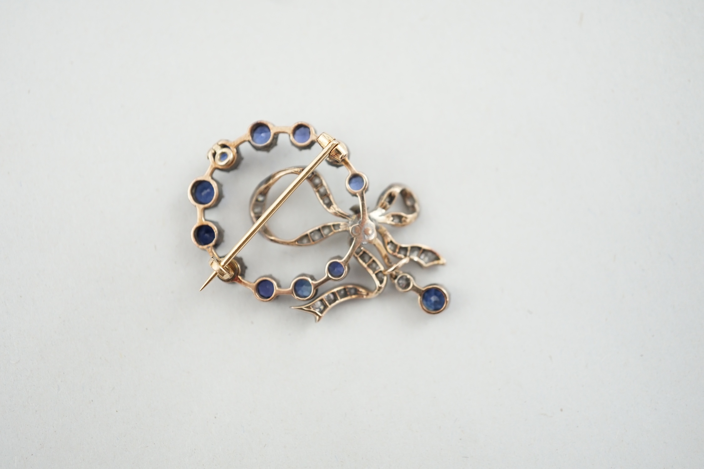 A Victorian gold and silver, sapphire and diamond cluster set drop pendant brooch